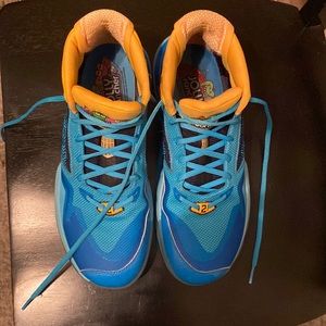 Kawhi Leonard New Balance basketball shoes. Blue and yellow. Size 10.5